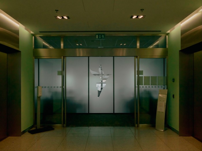 An entrance featuring glass doors