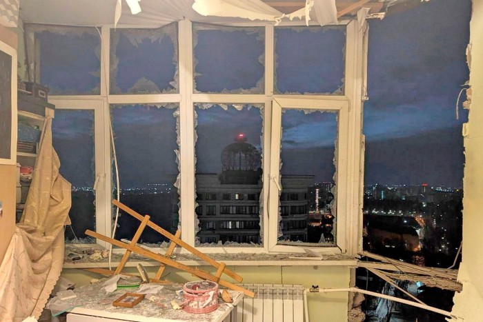 A damaged apartment on the site where a shot down Ukrainian drone fell, outside Moscow, Russia