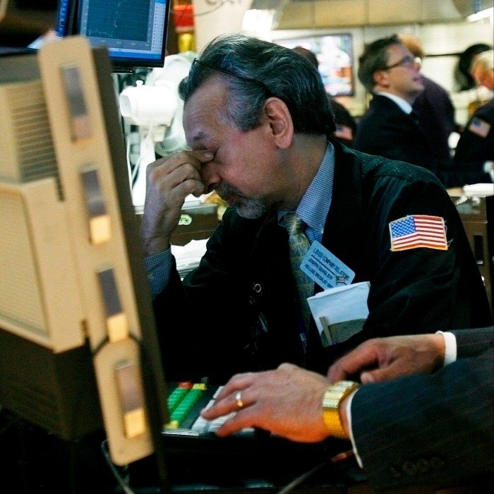 Traders work on the floor of the New York Stock Exchange 