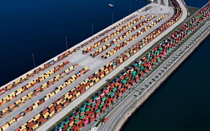 Containers loaded onto rail cars at a vehicle storage facility at the Port of Los Angeles