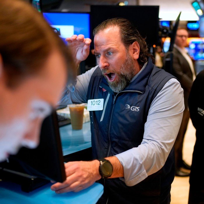 Traders work on the floor of the New York Stock Exchange 