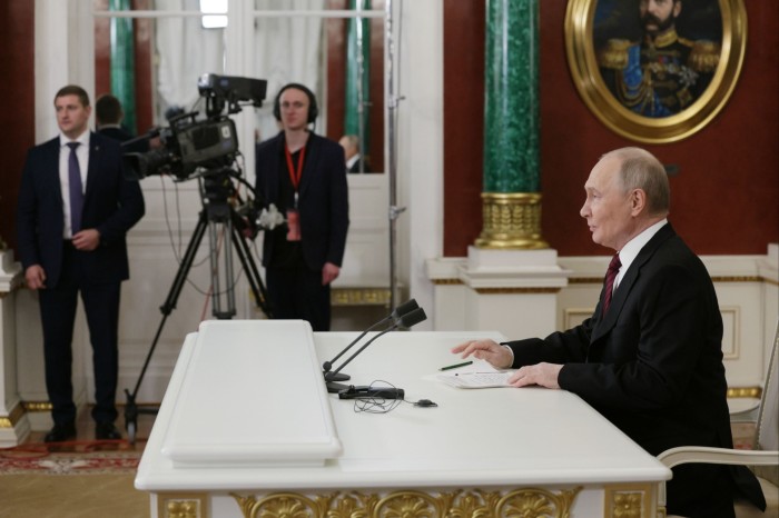 Vladimir Putin makes a statement to the media at the Kremlin